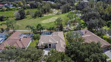 Exceptional home located on the 14th green of the Fazio designed on Hunters Green Country Club in Florida - for sale on GolfHomes.com, golf home, golf lot