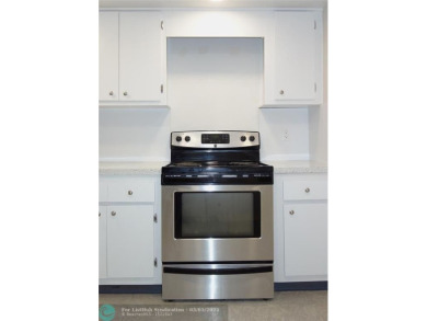 HUGE PRICE REDUCTION! This 5th-floor condo offers 1,500 square on Palm-Aire Country Club and Resort - The Oaks in Florida - for sale on GolfHomes.com, golf home, golf lot