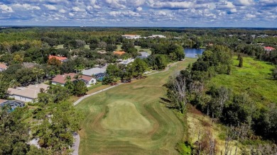 Exceptional home located on the 14th green of the Fazio designed on Hunters Green Country Club in Florida - for sale on GolfHomes.com, golf home, golf lot