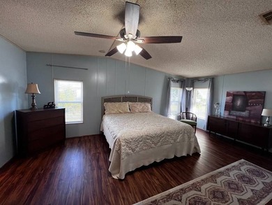 This 2-bedroom, 2-bath home offers 1,296 sq ft of comfortable on Lake Henry Golf Club in Florida - for sale on GolfHomes.com, golf home, golf lot