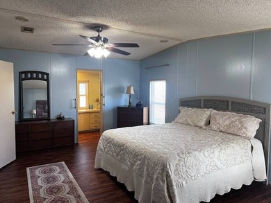 This 2-bedroom, 2-bath home offers 1,296 sq ft of comfortable on Lake Henry Golf Club in Florida - for sale on GolfHomes.com, golf home, golf lot