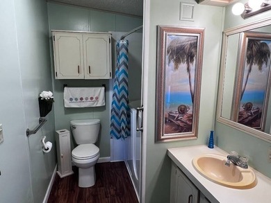 This 2-bedroom, 2-bath home offers 1,296 sq ft of comfortable on Lake Henry Golf Club in Florida - for sale on GolfHomes.com, golf home, golf lot