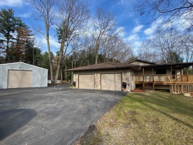 Set on a beautiful wooded 8+ acre lot this nicely updated 5 on Pine River Golf Club in Michigan - for sale on GolfHomes.com, golf home, golf lot