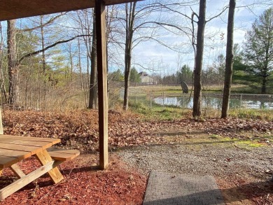 Set on a beautiful wooded 8+ acre lot this nicely updated 5 on Pine River Golf Club in Michigan - for sale on GolfHomes.com, golf home, golf lot