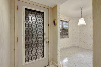 JUST PAINTED & WALLPAPER REMOVED! SALE OF THE CENTURY IN VIBRANT on Wynmoor Golf Course in Florida - for sale on GolfHomes.com, golf home, golf lot