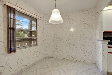 JUST PAINTED & WALLPAPER REMOVED! SALE OF THE CENTURY IN VIBRANT on Wynmoor Golf Course in Florida - for sale on GolfHomes.com, golf home, golf lot