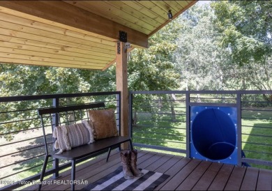 Discover elevated mountain living in this stunning 6-bedroom on Star Valley RV Golf Course in Wyoming - for sale on GolfHomes.com, golf home, golf lot