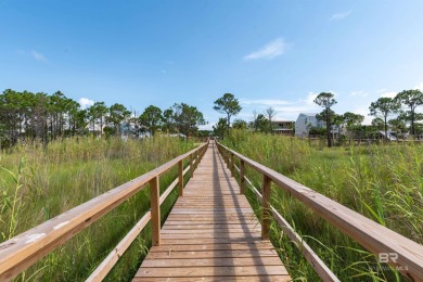 Fall in love with this lot in beautiful DeSoto Landing, the on Isle Dauphine Club Golf Course in Alabama - for sale on GolfHomes.com, golf home, golf lot