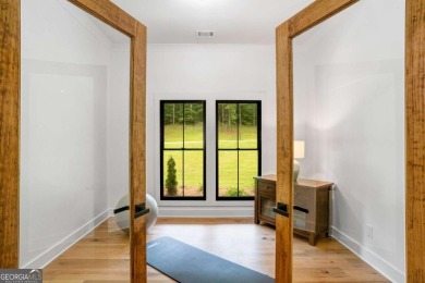 nWelcome to this stunning Craftsman home nestled on a beautiful on The Club River Forest in Georgia - for sale on GolfHomes.com, golf home, golf lot