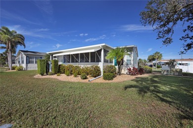 This amazing TRIPLE-wide Palm Harbor home is situated on a on Maple Leaf Golf and Country Club in Florida - for sale on GolfHomes.com, golf home, golf lot