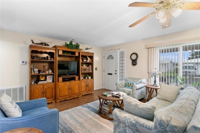 Welcome to this beautifully maintained 2-bedroom, 2-bath home on Mainlands Golf Club in Florida - for sale on GolfHomes.com, golf home, golf lot