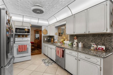 Welcome to this beautifully maintained 2-bedroom, 2-bath home on Mainlands Golf Club in Florida - for sale on GolfHomes.com, golf home, golf lot