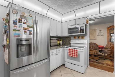 Welcome to this beautifully maintained 2-bedroom, 2-bath home on Mainlands Golf Club in Florida - for sale on GolfHomes.com, golf home, golf lot