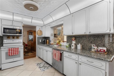 Welcome to this beautifully maintained 2-bedroom, 2-bath home on Mainlands Golf Club in Florida - for sale on GolfHomes.com, golf home, golf lot