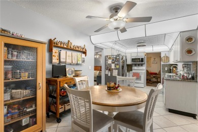 Welcome to this beautifully maintained 2-bedroom, 2-bath home on Mainlands Golf Club in Florida - for sale on GolfHomes.com, golf home, golf lot