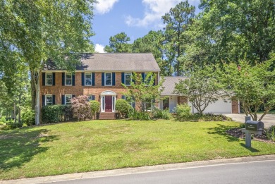 Stunning 4-bedroom, 3-bathroom brick residence situated on a on Woodside Plantation Country Club in South Carolina - for sale on GolfHomes.com, golf home, golf lot