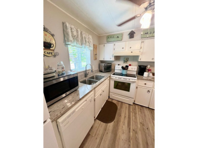This well-maintained two-bedroom, two-bathroom residence offers on Pine Lakes Country Club in Florida - for sale on GolfHomes.com, golf home, golf lot
