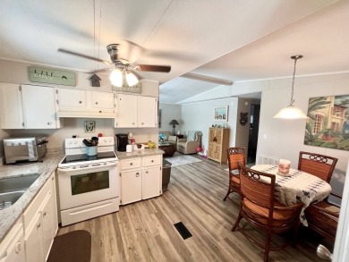 This well-maintained two-bedroom, two-bathroom residence offers on Pine Lakes Country Club in Florida - for sale on GolfHomes.com, golf home, golf lot