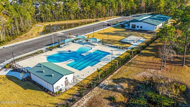 Fantastic homesite with pond view ready for the perfect setting on Ocean Ridge Plantation in North Carolina - for sale on GolfHomes.com, golf home, golf lot