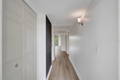 Experience resort-style living in this spacious 2-bedroom on Pine Island Ridge Country Club in Florida - for sale on GolfHomes.com, golf home, golf lot
