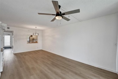 Experience resort-style living in this spacious 2-bedroom on Pine Island Ridge Country Club in Florida - for sale on GolfHomes.com, golf home, golf lot