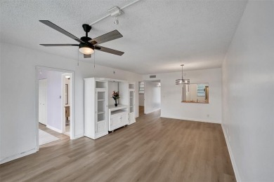 Experience resort-style living in this spacious 2-bedroom on Pine Island Ridge Country Club in Florida - for sale on GolfHomes.com, golf home, golf lot