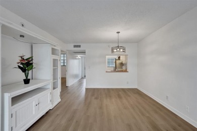 Experience resort-style living in this spacious 2-bedroom on Pine Island Ridge Country Club in Florida - for sale on GolfHomes.com, golf home, golf lot