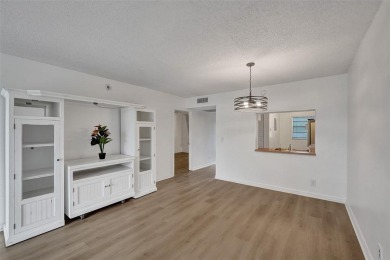 Experience resort-style living in this spacious 2-bedroom on Pine Island Ridge Country Club in Florida - for sale on GolfHomes.com, golf home, golf lot