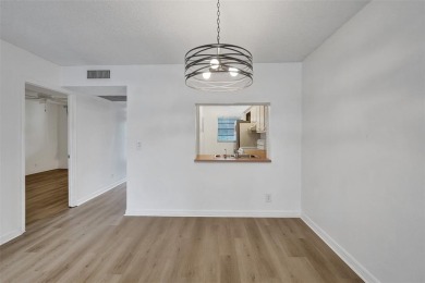 Experience resort-style living in this spacious 2-bedroom on Pine Island Ridge Country Club in Florida - for sale on GolfHomes.com, golf home, golf lot