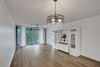 Experience resort-style living in this spacious 2-bedroom on Pine Island Ridge Country Club in Florida - for sale on GolfHomes.com, golf home, golf lot