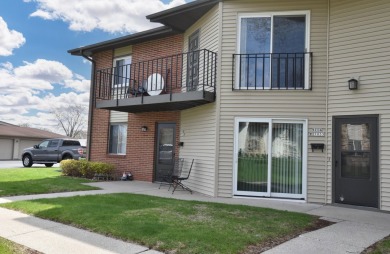 Enjoy open-concept living in this modern upper-level condo on BlackStone Creek Golf Club in Wisconsin - for sale on GolfHomes.com, golf home, golf lot