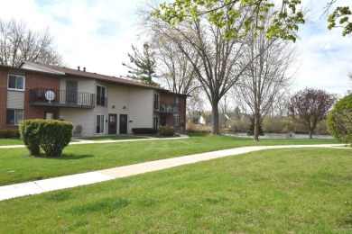 Enjoy open-concept living in this modern upper-level condo on BlackStone Creek Golf Club in Wisconsin - for sale on GolfHomes.com, golf home, golf lot