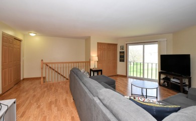 Enjoy open-concept living in this modern upper-level condo on BlackStone Creek Golf Club in Wisconsin - for sale on GolfHomes.com, golf home, golf lot