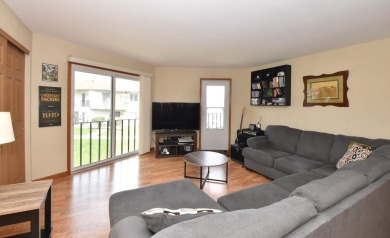 Enjoy open-concept living in this modern upper-level condo on BlackStone Creek Golf Club in Wisconsin - for sale on GolfHomes.com, golf home, golf lot