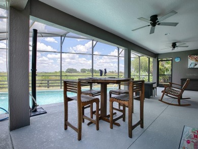 BOND PAID on this STUNNING 3/2 IRIS with SALT WATER HEATED POOL on Evans Prairie Golf and Country Club in Florida - for sale on GolfHomes.com, golf home, golf lot