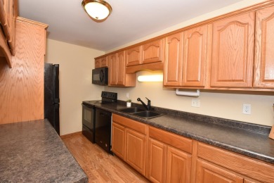 Enjoy open-concept living in this modern upper-level condo on BlackStone Creek Golf Club in Wisconsin - for sale on GolfHomes.com, golf home, golf lot