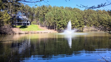 This beautiful 1.35 acre wooded interior waterfront lot is on Granada Farms Country Club in North Carolina - for sale on GolfHomes.com, golf home, golf lot