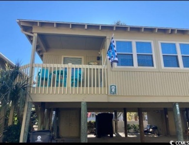This great 4 bedroom, 3 bath cottage is one block from beach on The Dunes Golf and Beach Club in South Carolina - for sale on GolfHomes.com, golf home, golf lot