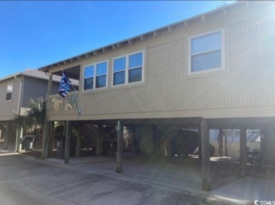 This great 4 bedroom, 3 bath cottage is one block from beach on The Dunes Golf and Beach Club in South Carolina - for sale on GolfHomes.com, golf home, golf lot