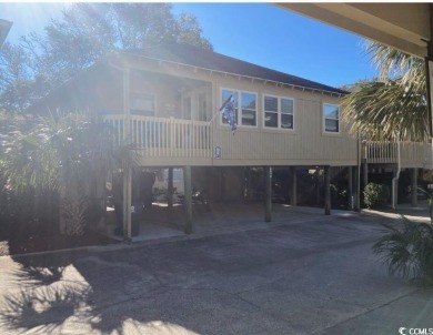 This great 4 bedroom, 3 bath cottage is one block from beach on The Dunes Golf and Beach Club in South Carolina - for sale on GolfHomes.com, golf home, golf lot