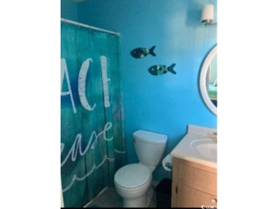 This great 4 bedroom, 3 bath cottage is one block from beach on The Dunes Golf and Beach Club in South Carolina - for sale on GolfHomes.com, golf home, golf lot