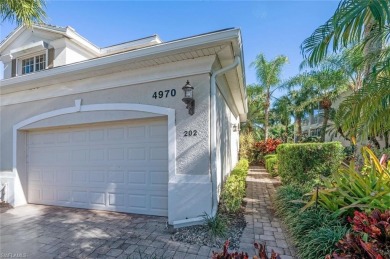 Experience luxury living in this spacious second-floor end unit on Naples Lakes Country Club in Florida - for sale on GolfHomes.com, golf home, golf lot