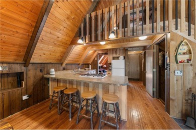 Impressively updated and meticulously maintained A-frame on Voyager Village Country Club - Voyager in Wisconsin - for sale on GolfHomes.com, golf home, golf lot