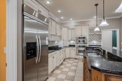 Custom European-style stucco and stone home in a 18-hole golf on Madisonville Golf and Country Club in Kentucky - for sale on GolfHomes.com, golf home, golf lot