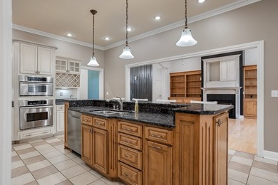 Custom European-style stucco and stone home in a 18-hole golf on Madisonville Golf and Country Club in Kentucky - for sale on GolfHomes.com, golf home, golf lot