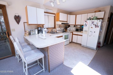 Cozy up in style in this beautifully maintained Poconos chalet on The Hideout Golf in Pennsylvania - for sale on GolfHomes.com, golf home, golf lot