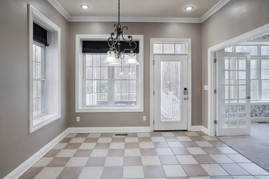 Custom European-style stucco and stone home in a 18-hole golf on Madisonville Golf and Country Club in Kentucky - for sale on GolfHomes.com, golf home, golf lot