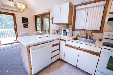 Cozy up in style in this beautifully maintained Poconos chalet on The Hideout Golf in Pennsylvania - for sale on GolfHomes.com, golf home, golf lot