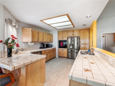Welcome to 14996 Shady Elm, a warm and inviting 3-bedroom on Silver Lakes Golf Course in California - for sale on GolfHomes.com, golf home, golf lot
