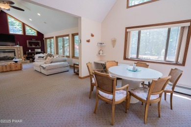 Cozy up in style in this beautifully maintained Poconos chalet on The Hideout Golf in Pennsylvania - for sale on GolfHomes.com, golf home, golf lot